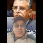 Split-screen image with two men: a serious man in a suit on the top half and a man in a cap and glasses speaking at the bottom, with Arabic captions across the lower area.