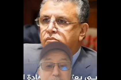 Split-screen image with two men: a serious man in a suit on the top half and a man in a cap and glasses speaking at the bottom, with Arabic captions across the lower area.